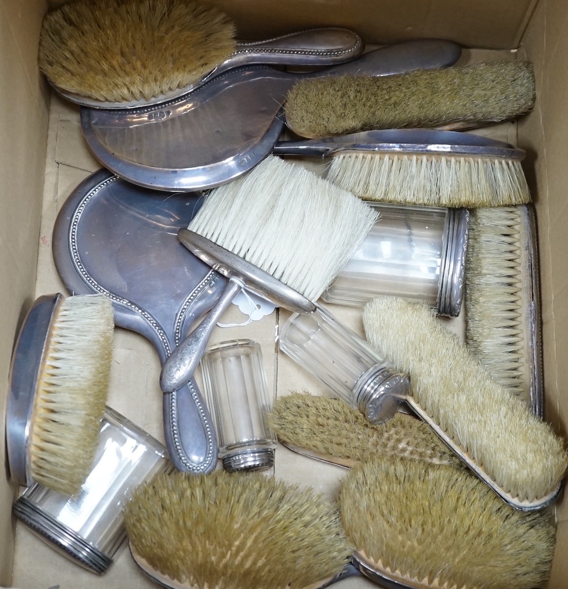 A quantity of assorted silver mounted hand mirrors, brushes and toilet jars, various dates and makers
